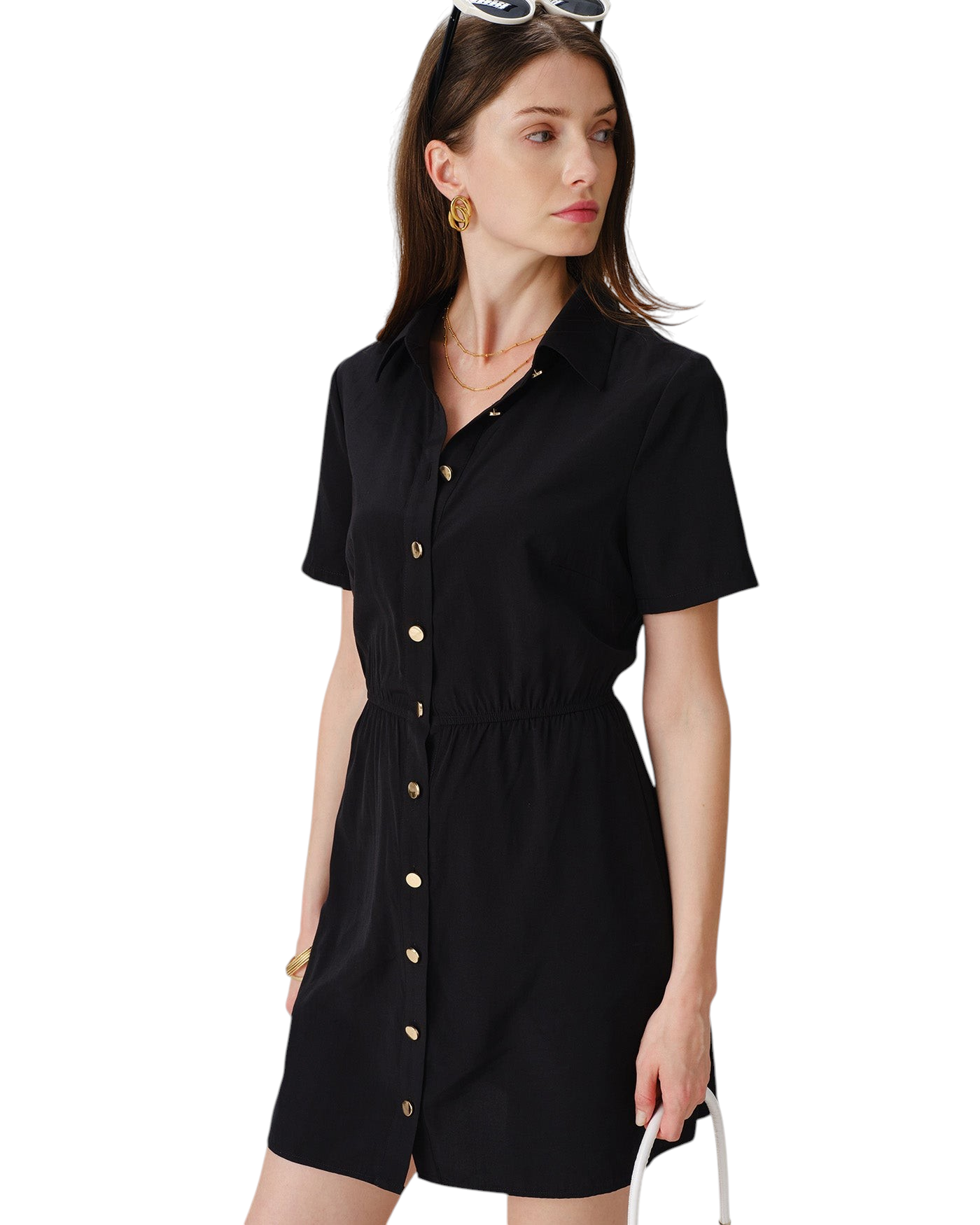 Model wearing a black zevrion mini shirt dress with short sleeves, collar, and gold buttons for a work outfit.