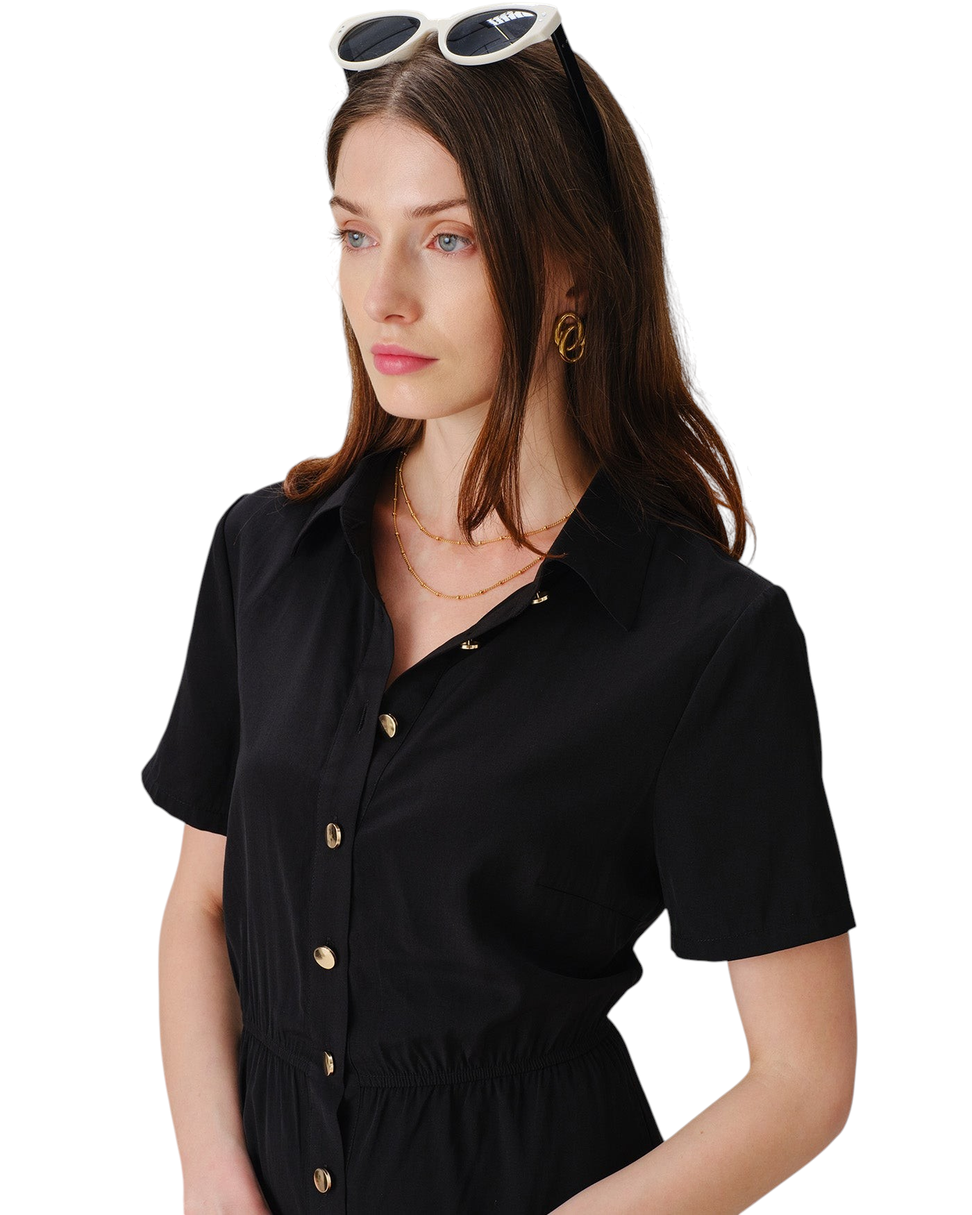 zevrion black mini shirt dress with collar, short sleeves, and gold buttons worn by a model with sunglasses