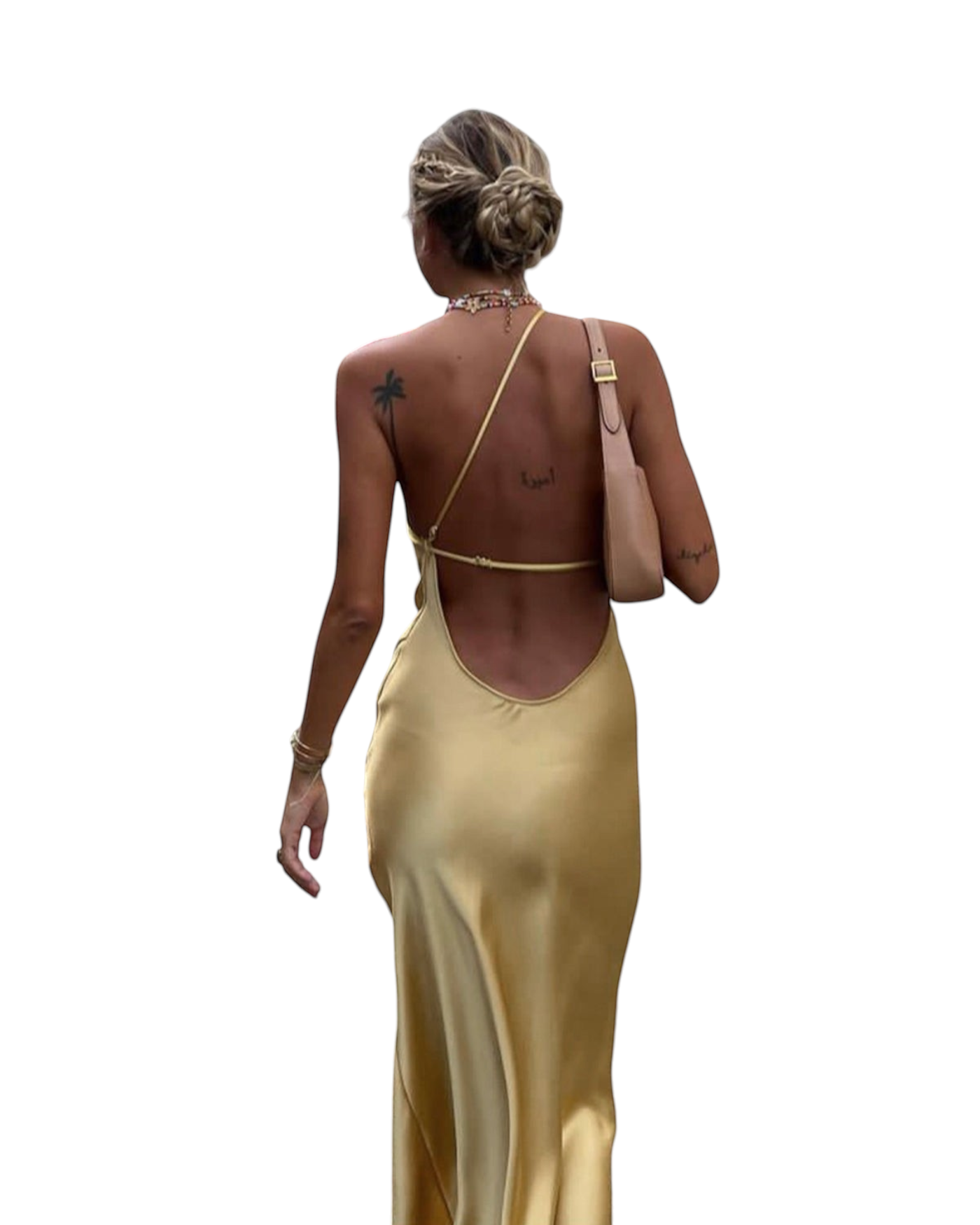 zevrion gold satin maxi dress with an open back and thin straps worn by a woman walking away