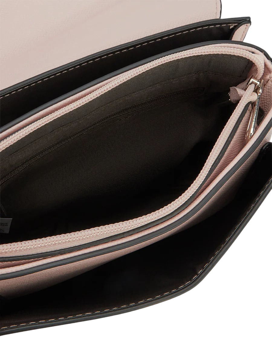 Interior view of the Zevrion Mariko shoulder bag in soft pink with black trim and multiple zippered compartments.