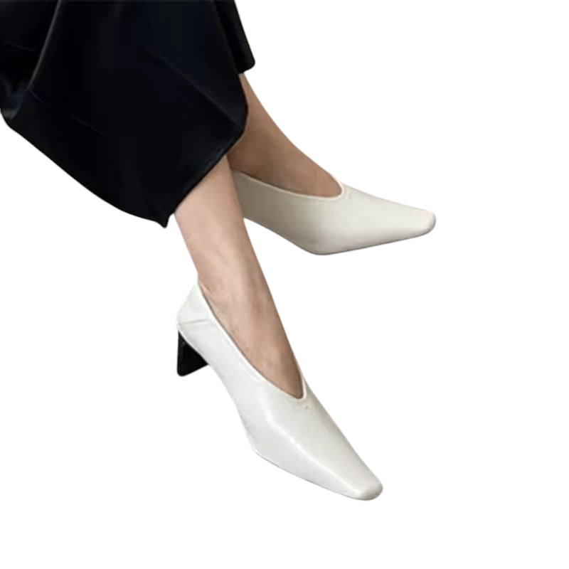 zevrion white leather heels with a V-neckline design worn on feet for a sophisticated and elegant look
