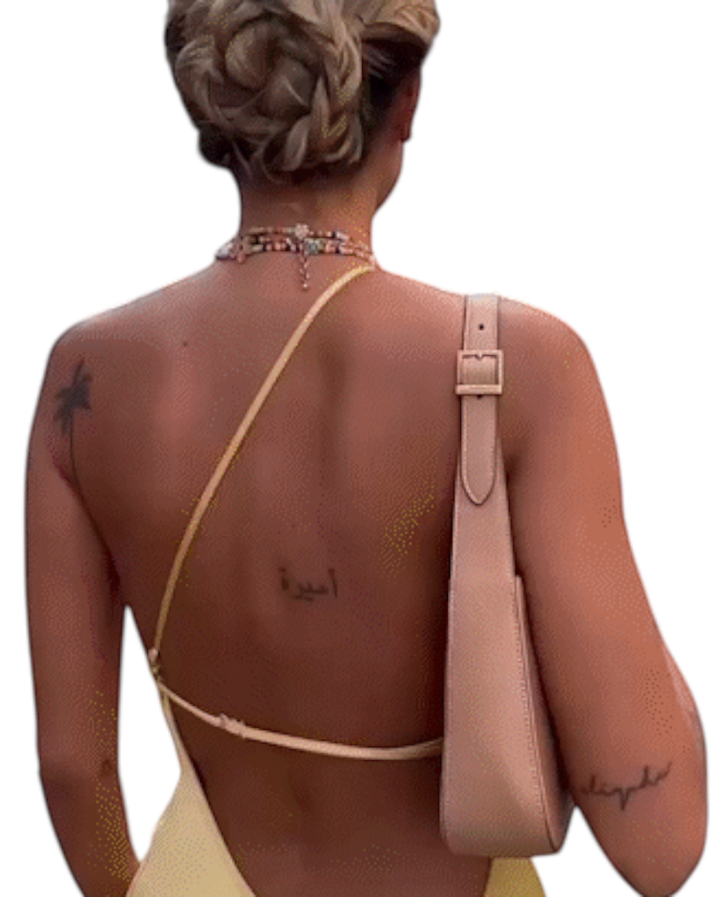zevrion backless yellow satin maxi dress with thin straps worn by a woman with an updo hairstyle